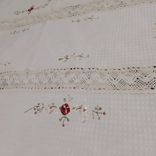 Embroidered tablecloth like new with satin ribbon and floral motifs
