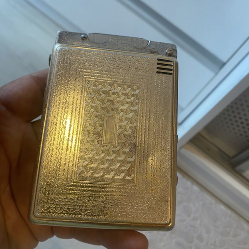 Tobacco case with petrol lighter used
