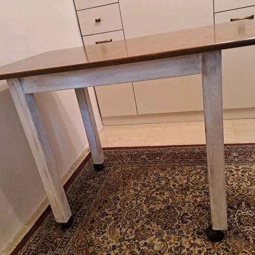 Wooden dining set like new with 2 chairs and wheels