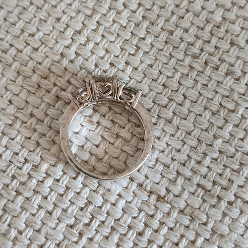 Trilogy silver plated ring used with zircon and heart motifs