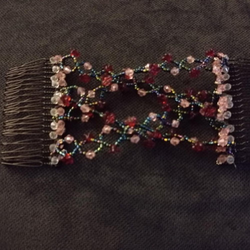 Hair comb like new with red, pink, black and transparent beads