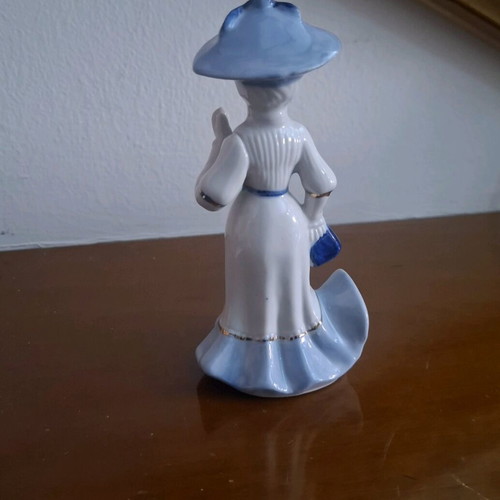 Retro porcelain woman figurine with gold details like new