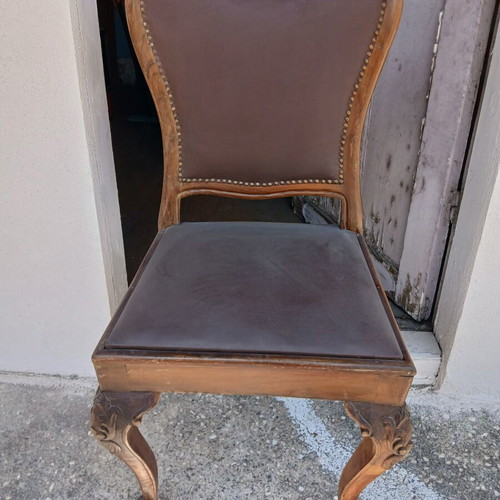 Dining set used, solid wood with carved designs and leather chairs