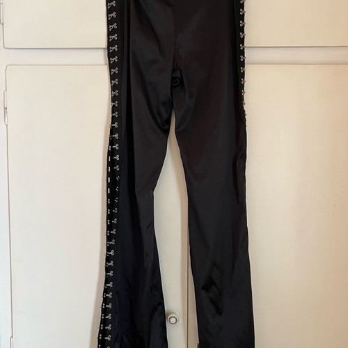 New shiny black pants with a design on the side