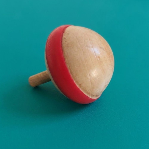 Wooden spinning top with hand-painted folk art design