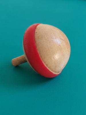 Wooden spinning top with hand-painted folk art design