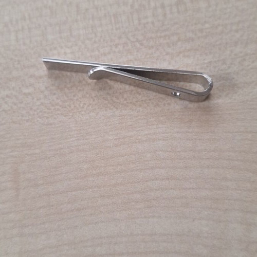 Silver tie clip used, gray