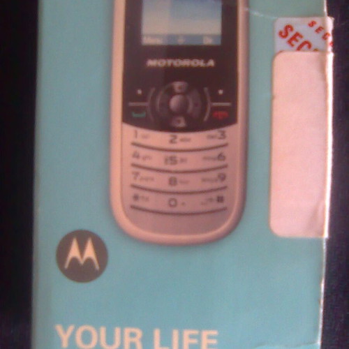 Motorola WX181 like new mobile phone with charger, headphones, and box
