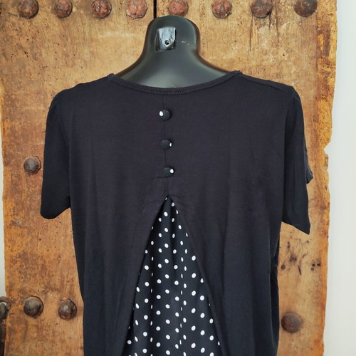 Women's black T-shirt with polka dot chiffon open back and button detail