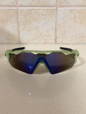 Green sport sunglasses with mirrored lenses