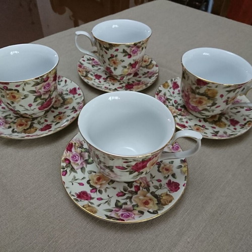 Tea and Coffee Cup Set like new, porcelain with floral pattern