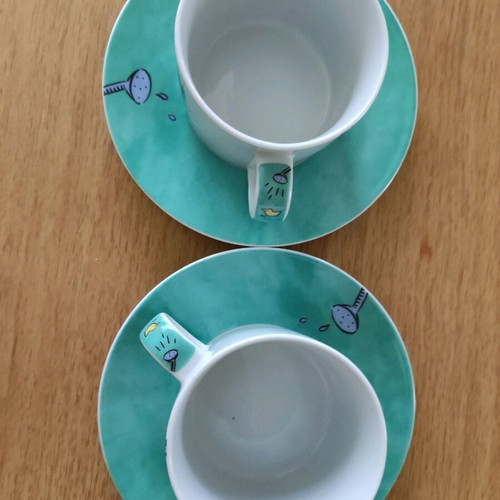 Set of 2 coffee cups with saucers like new, turquoise with hippopotamus