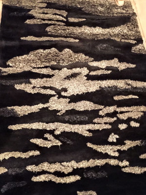 Black and silver rug with embossed designs 216x155 cm