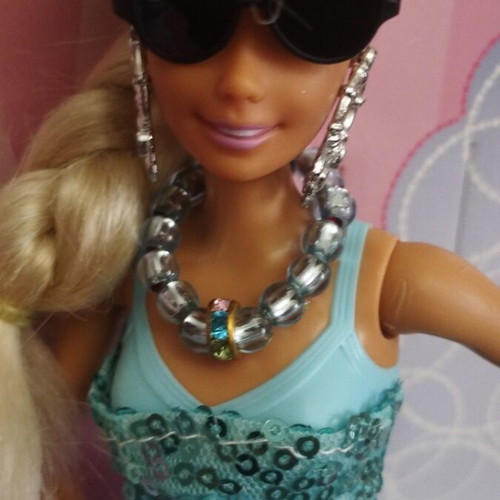 Vintage Barbie doll with handmade shoes and accessories
