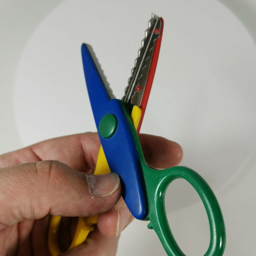 Craft scissors used with colorful zig-zag cuts for kids
