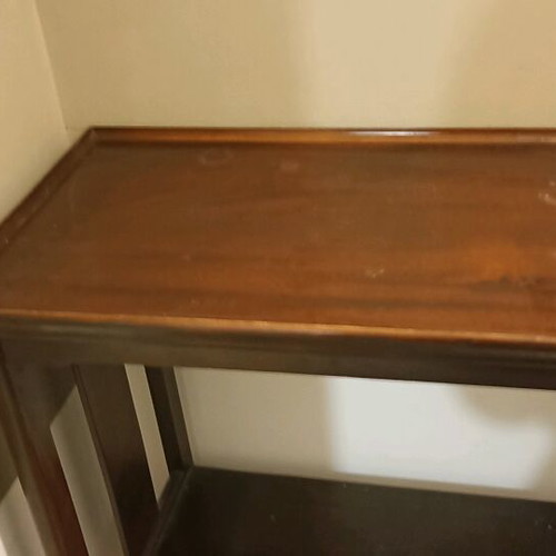 Wooden vintage coffee table like new with decorative wheels