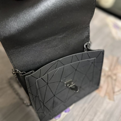 Women's black shoulder bag with geometric design, like new