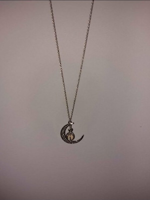 Moon necklace new, gray that glows in the dark