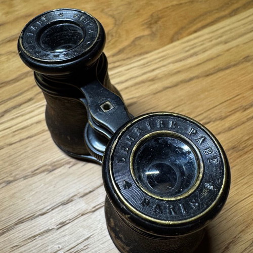 Vintage French binoculars used with leather covering good condition