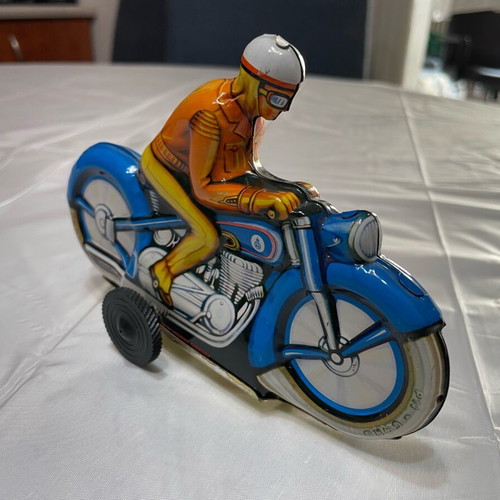 Motorcyclist vintage tin toy made in West Germany like new
