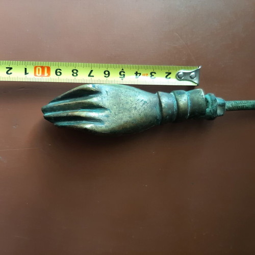 Antique bronze door knocker in hand shape