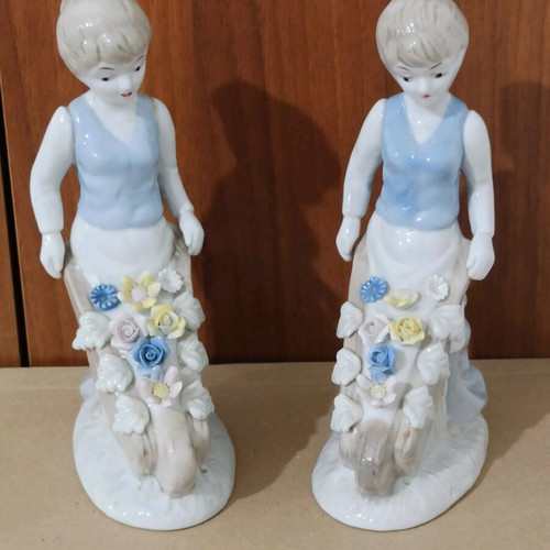 Porcelain figures of girls with cart and flowers like new, set of 2