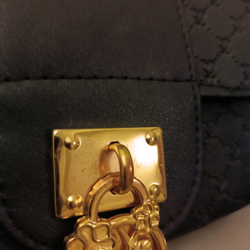 Handbag like new black with metal decoration