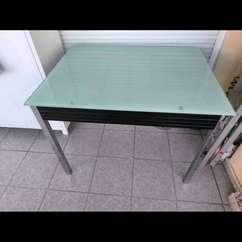 Extendable dining table with four chairs used, leather seats