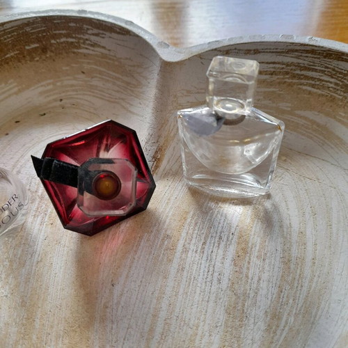 Miniatures of branded perfumes used, empty bottles