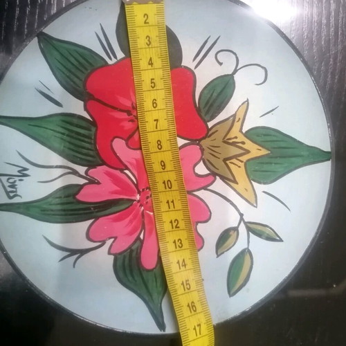 Handmade decorative clay plate painted by hand