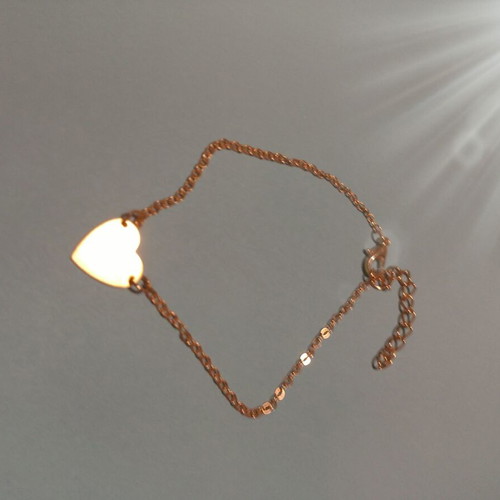 Gold-colored heart bracelet with chain