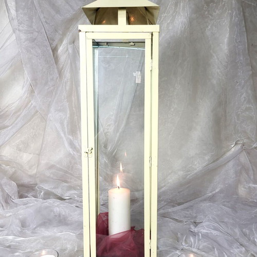 Set of used off-white metal floor lanterns for wedding and baptism