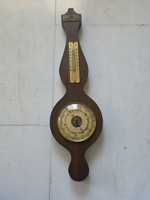 Vintage wooden barometer and thermometer wall decoration used