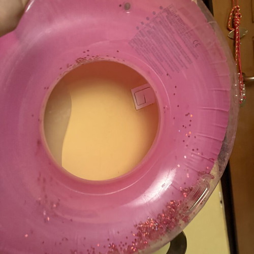 Pink inflatable pool float with glitter