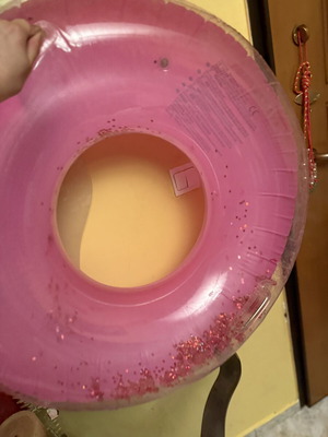 Pink inflatable pool float with glitter