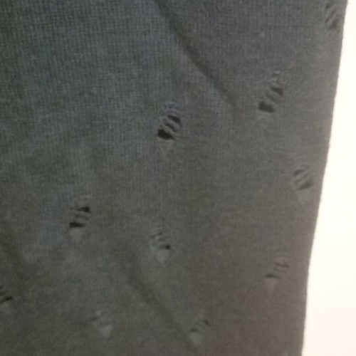 Long knitted gray dress used with loose neckline and decorative holes
