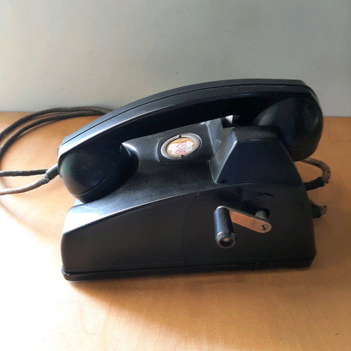 Antique telephone with crank used, 1920-30