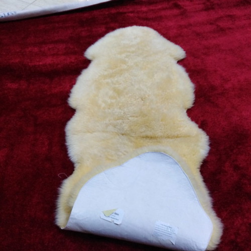 Sheepskin rug new, champagne color 2.05x0.75