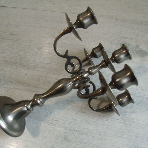 Old metal candlestick with five holders used