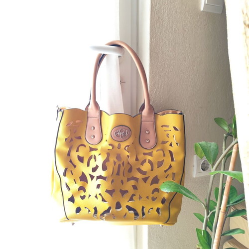Yellow handbag used with beige details