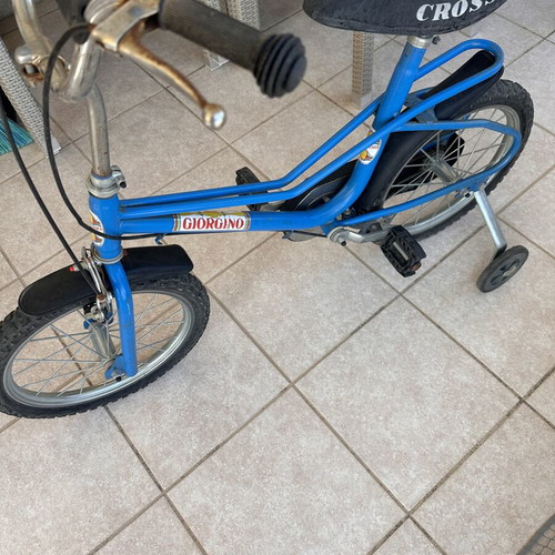 Vintage children's bike used, blue with training wheels for ages 5-7