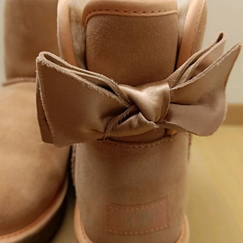 UGG pink boots with satin bow, like new