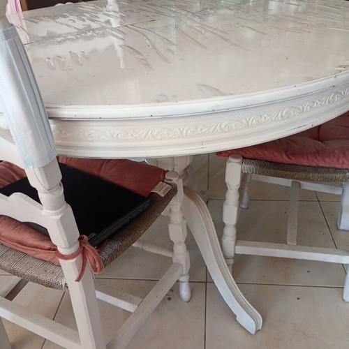 Vintage round dining table with 3 wooden chairs and rattan seats