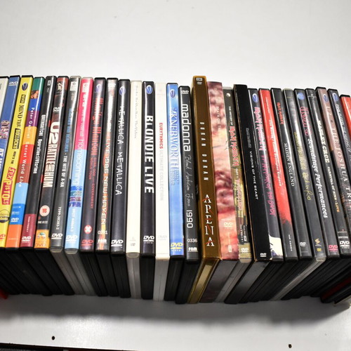 Music collection of 360 rock, pop, metal CDs, 29 music DVDs, 2 VHS tapes, with 2 CD shelves
