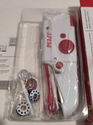 Handheld sewing machine used