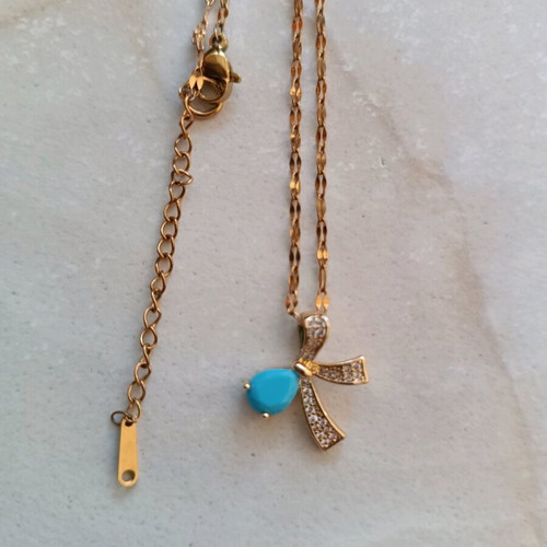 Necklace with silver-plated chain and bow design with turquoise stone like new