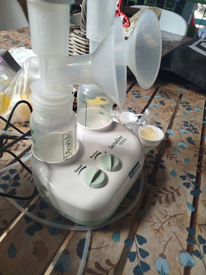 Ameda Double Breast Pump like new with 3 bottles and milk storage bags