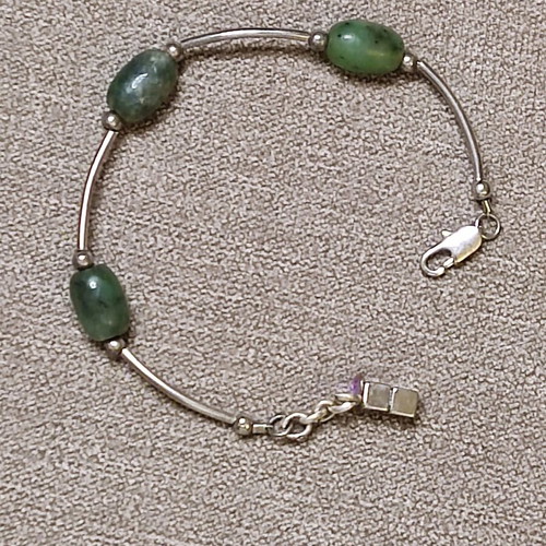 Minimal bracelet with green stones and silver details like new