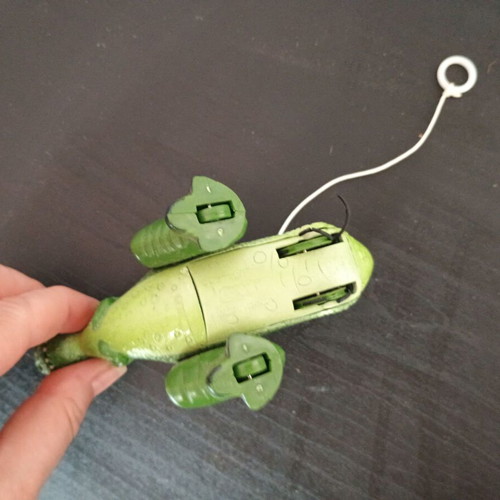 Small green dinosaur toy