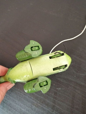 Small green dinosaur toy